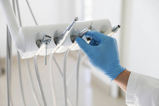 Professional Tooth Extraction technician working in Laguna Beach, FL